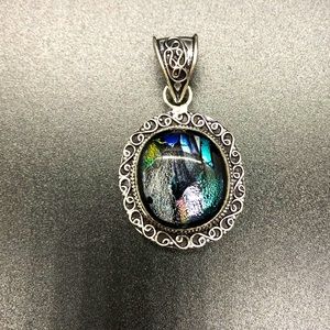 Dichroic glass set in silver pendant